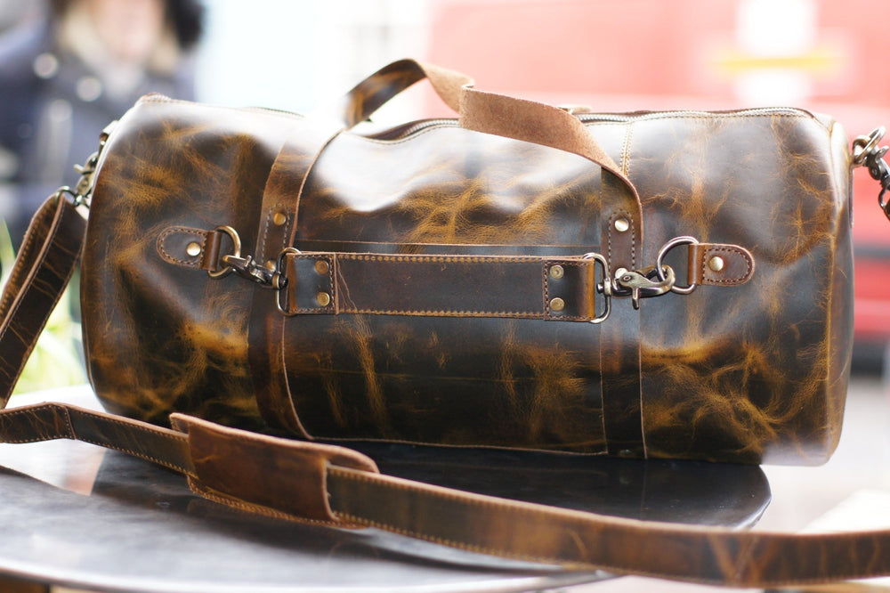 The Battlefield Barrel -  Mens Leather Duffel Bag by ArchieSoul Man + FreThe Style
Our Battlefield Barrel bag is a classic barrel design which provides that rugged masculine look, great capacity, and perfect for carry on baggage.
Extremely hLeather Duffle BagArchieSoul ManArchieSoul MenBattlefield Barrel